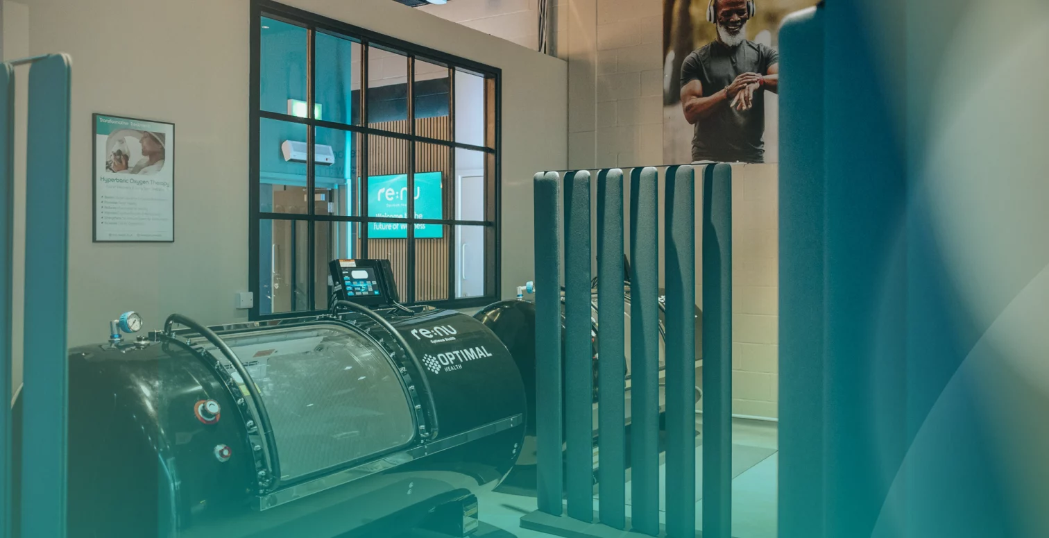 Close up of the Re:nu Optimal hyperbaric oxygen chamber with a blue gradient overlay